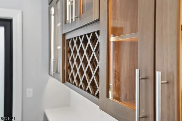 a kitchen with stainless steel appliances granite countertop a stove a sink and white cabinets