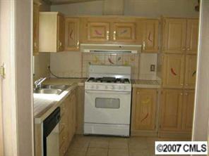 3293 Woodland Court Road Lancaster, SC 29720 - Photo 2 of 6 a stove top oven sitting inside of a kitchen