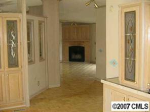 3293 Woodland Court Road Lancaster, SC 29720 - Photo 4 of 6 a view of a hallway with wooden floor