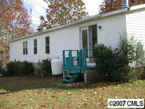 3293 Woodland Court Road Lancaster, SC 29720 - Photo 5 of 6 a view of a house with backyard and garden