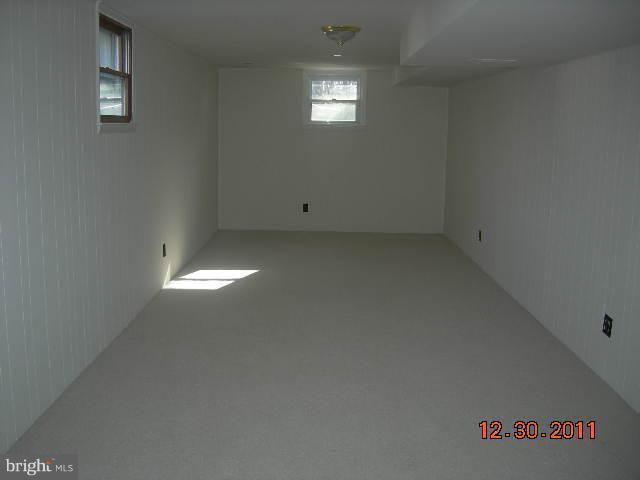 3317 Kenjac Road Windsor Mill, MD 21244 - Photo 5 of 12 a view of an empty room and window