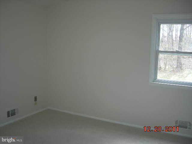 3317 Kenjac Road Windsor Mill, MD 21244 - Photo 8 of 12 an empty room with a window