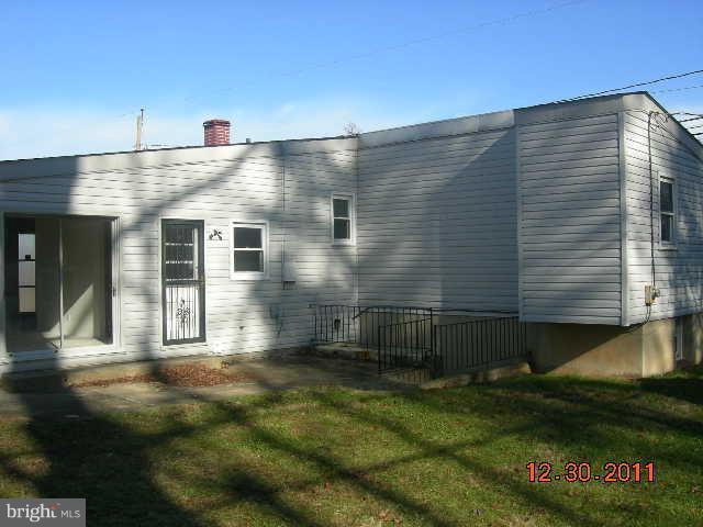 3317 Kenjac Road Windsor Mill, MD 21244 - Photo 9 of 12 a front view of a house with a yard