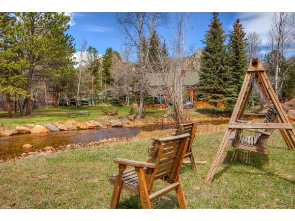 a view of a yard with swimming pool