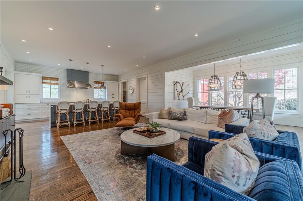 220 Audreys Way Suwanee, GA 30024 - Photo 12 of 66 a living room with furniture kitchen view and a large window