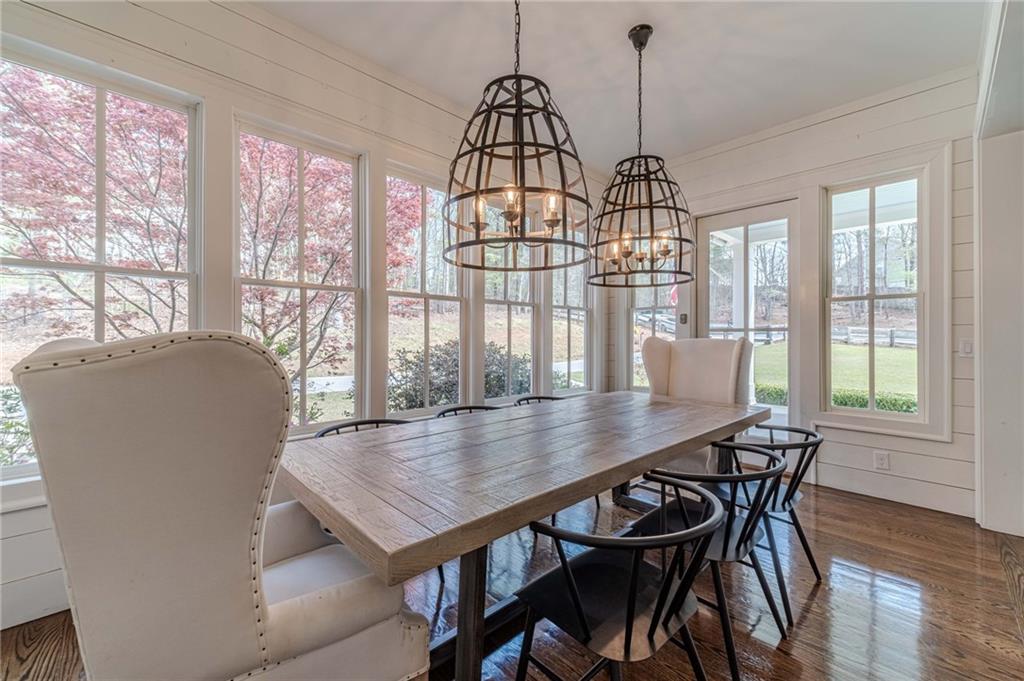 220 Audreys Way Suwanee, GA 30024 - Photo 15 of 66 a view of a dining room with furniture window and wooden floor