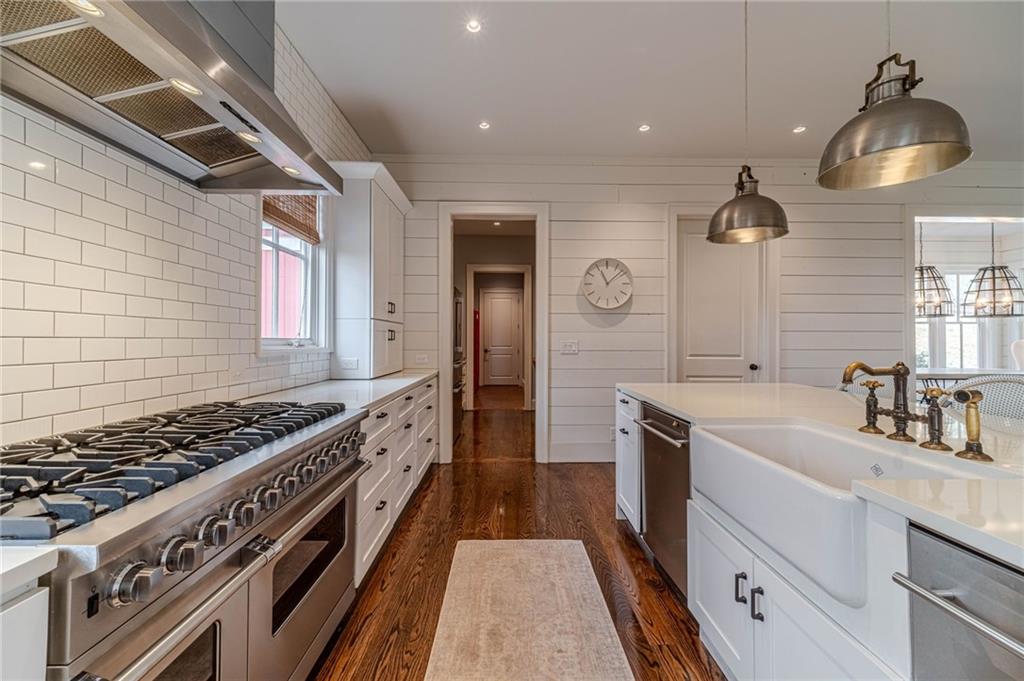 220 Audreys Way Suwanee, GA 30024 - Photo 20 of 66 a kitchen with a stove and a sink