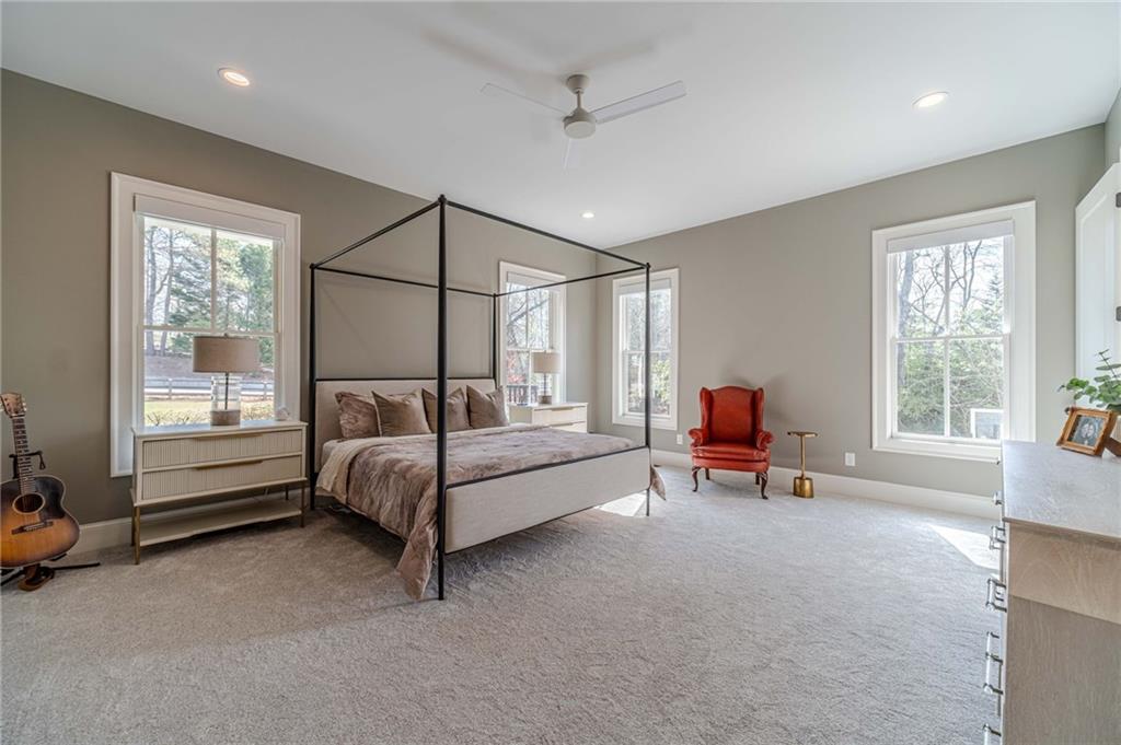 220 Audreys Way Suwanee, GA 30024 - Photo 28 of 66 a bedroom with furniture and a window