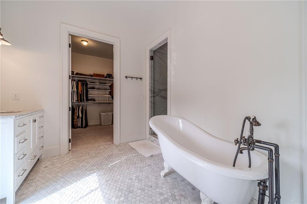 220 Audreys Way Suwanee, GA 30024 - Photo 31 of 66 a living room with furniture and a chandelier