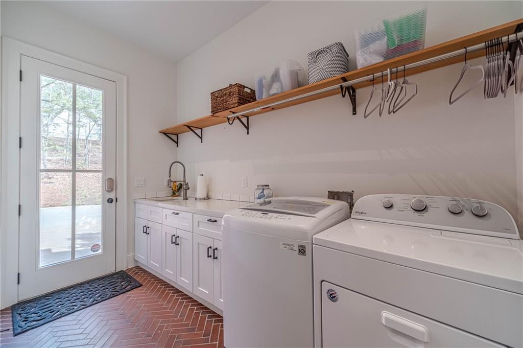 220 Audreys Way Suwanee, GA 30024 - Photo 34 of 66 a utility room with dryer and washer
