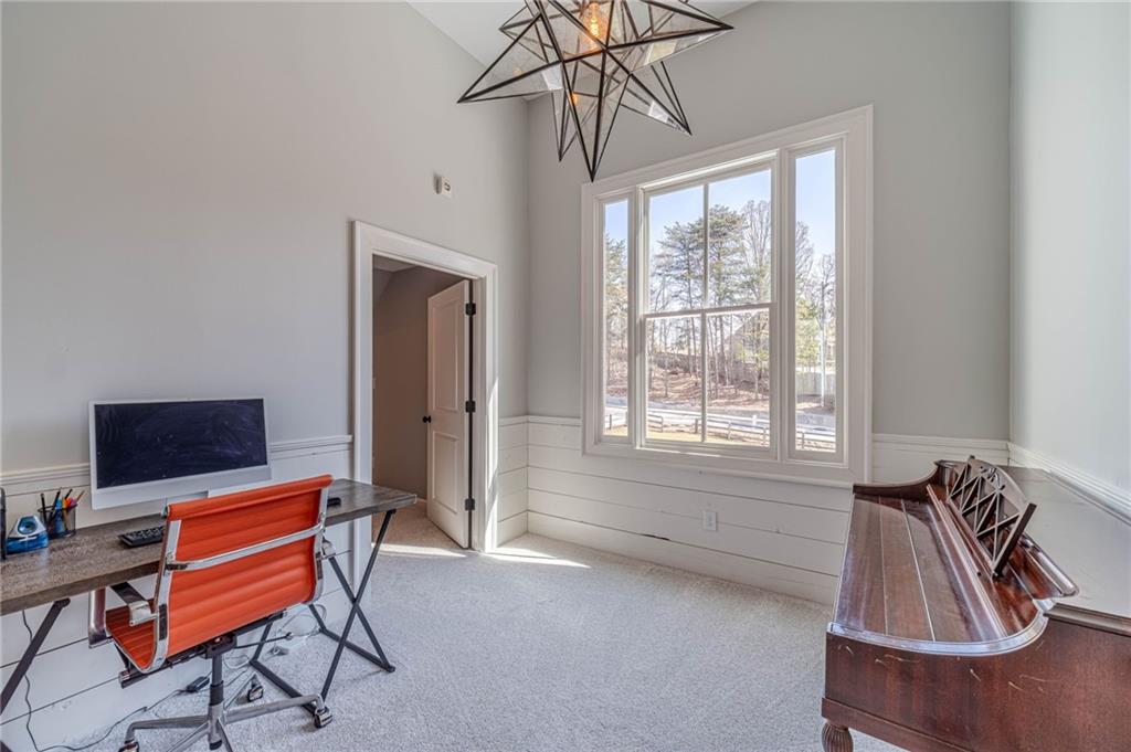 220 Audreys Way Suwanee, GA 30024 - Photo 37 of 66 a view of a livingroom with furniture and a window