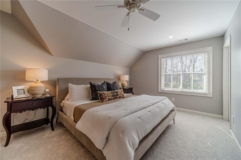 220 Audreys Way Suwanee, GA 30024 - Photo 39 of 66 a bedroom with bed and window