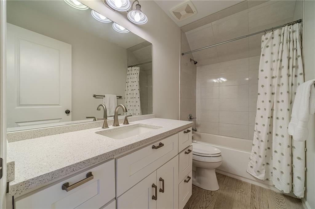 220 Audreys Way Suwanee, GA 30024 - Photo 44 of 66 a bathroom with a sink a toilet and shower