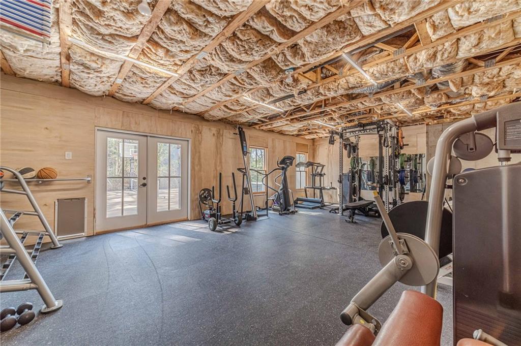 220 Audreys Way Suwanee, GA 30024 - Photo 49 of 66 a view of a room with gym equipment