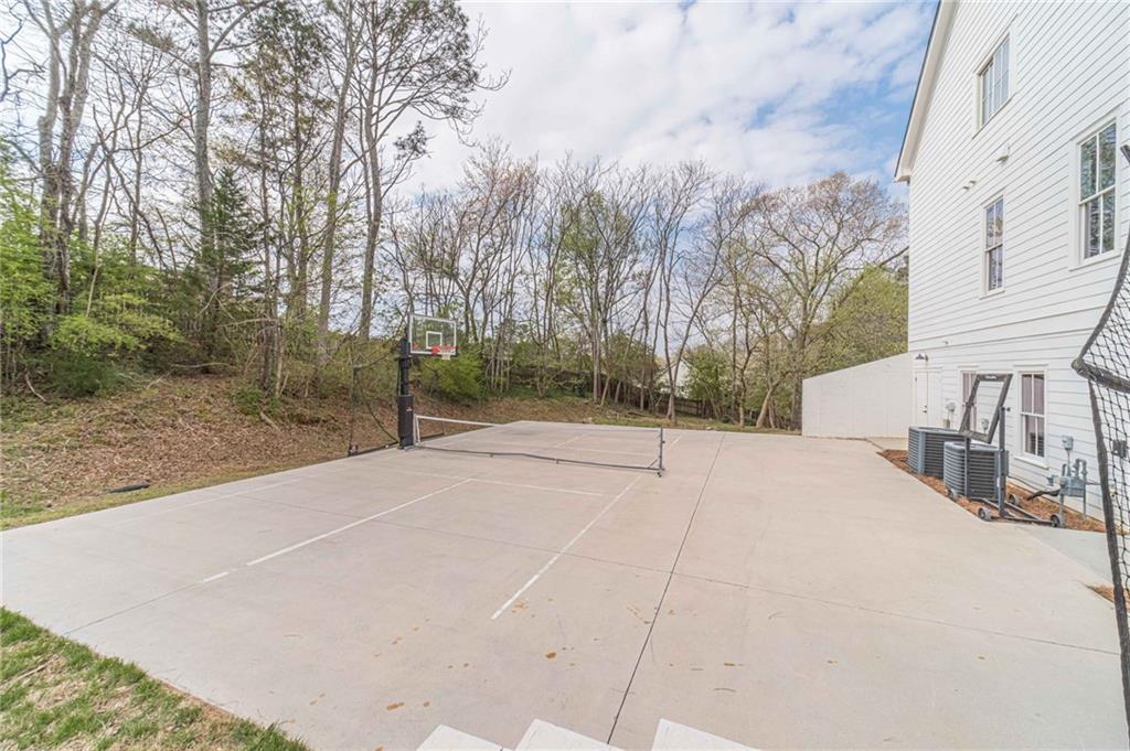 220 Audreys Way Suwanee, GA 30024 - Photo 58 of 66 a view of a house with a snow on the road