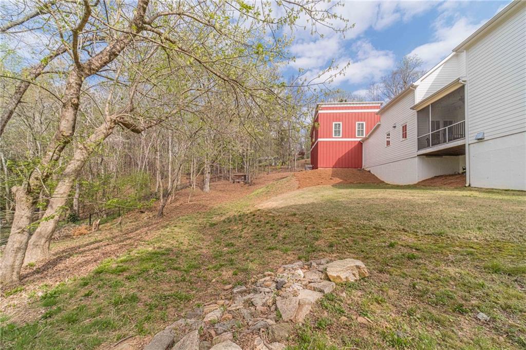220 Audreys Way Suwanee, GA 30024 - Photo 60 of 66 a view of a yard with an trees