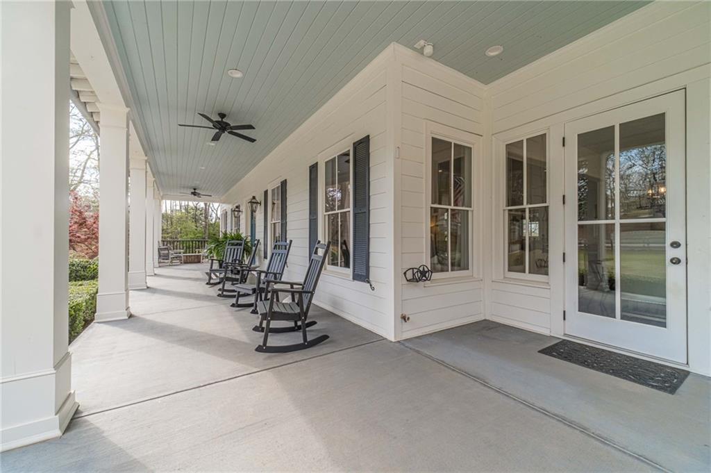 220 Audreys Way Suwanee, GA 30024 - Photo 8 of 66 a view of an entryway with outdoor seating