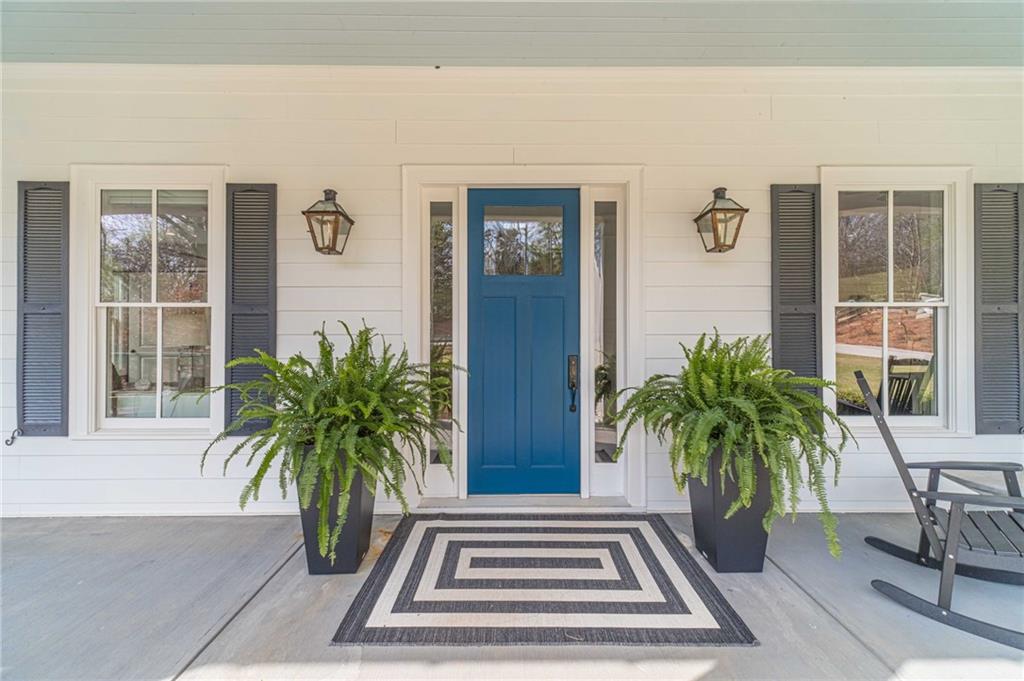 220 Audreys Way Suwanee, GA 30024 - Photo 9 of 66 a potted plants in front of a house