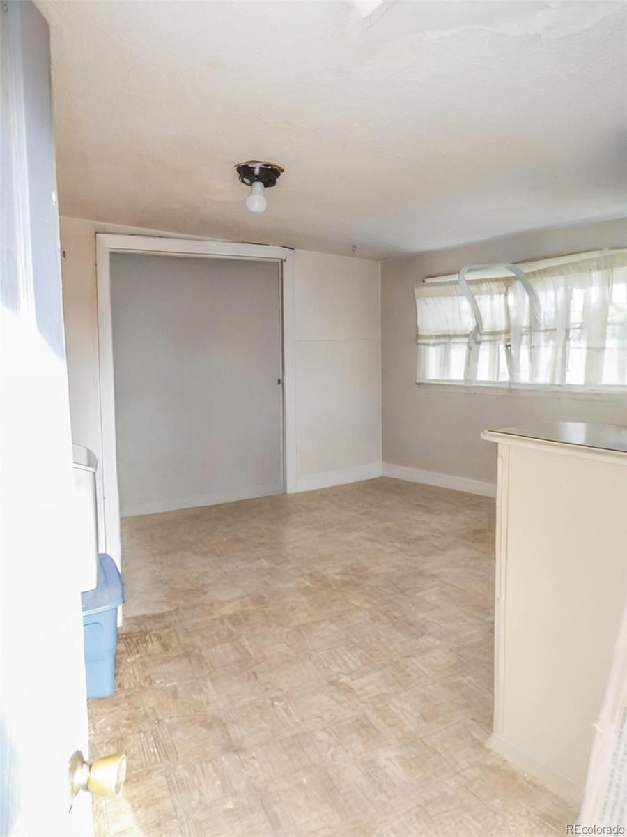 910 Elm Street Pueblo, CO 81004 - Photo 12 of 17 an empty room with windows