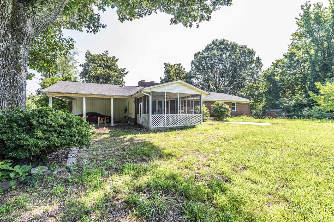 725 Old Brownsville Road Ripley, TN 38063 - Photo 31 of 40 a front view of a house with a yard table and chairs