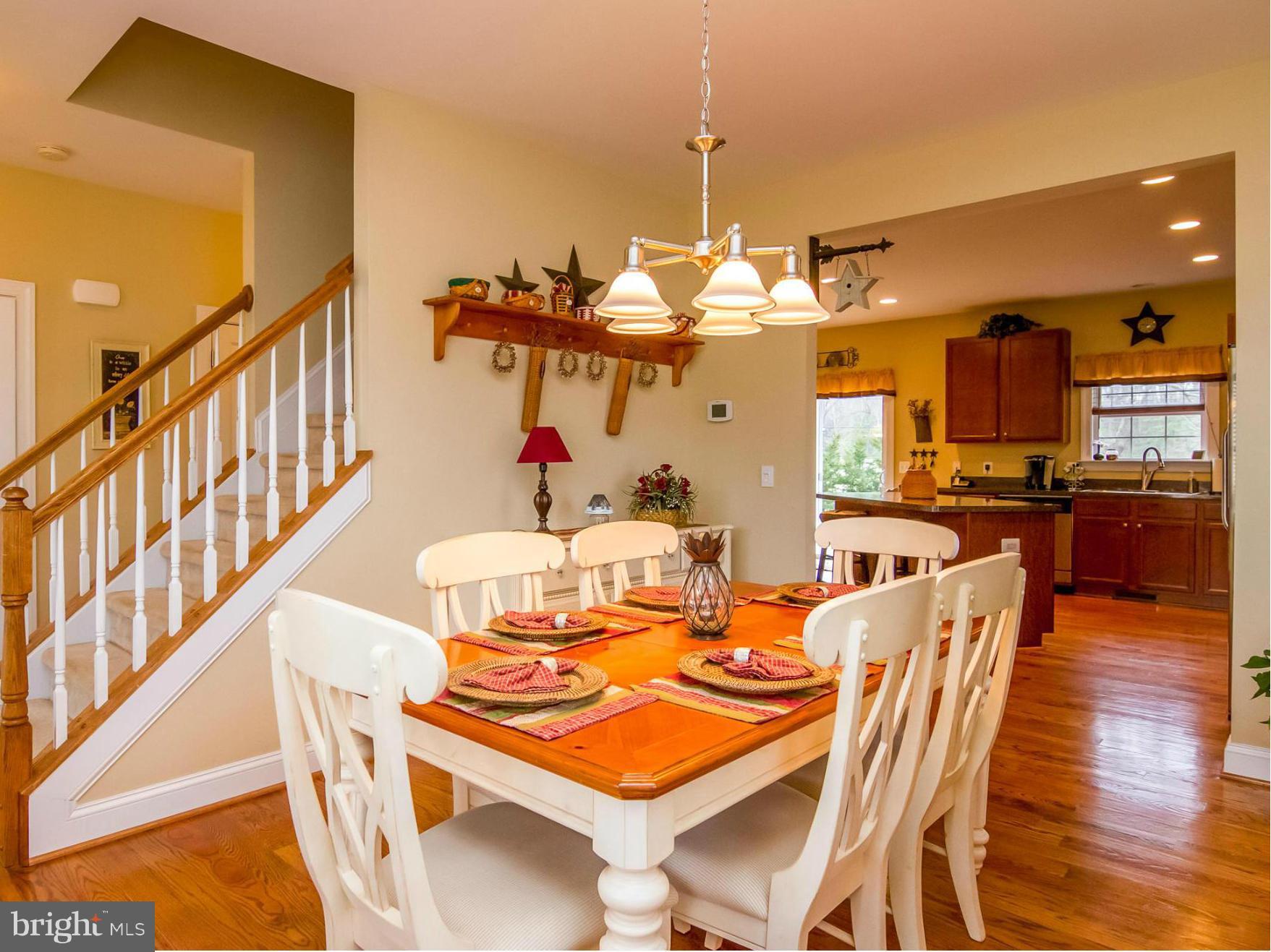 4021 Brummel Road Pasadena, MD 21122 - Photo 2 of 27 a view of a dining room with furniture and a chandelier