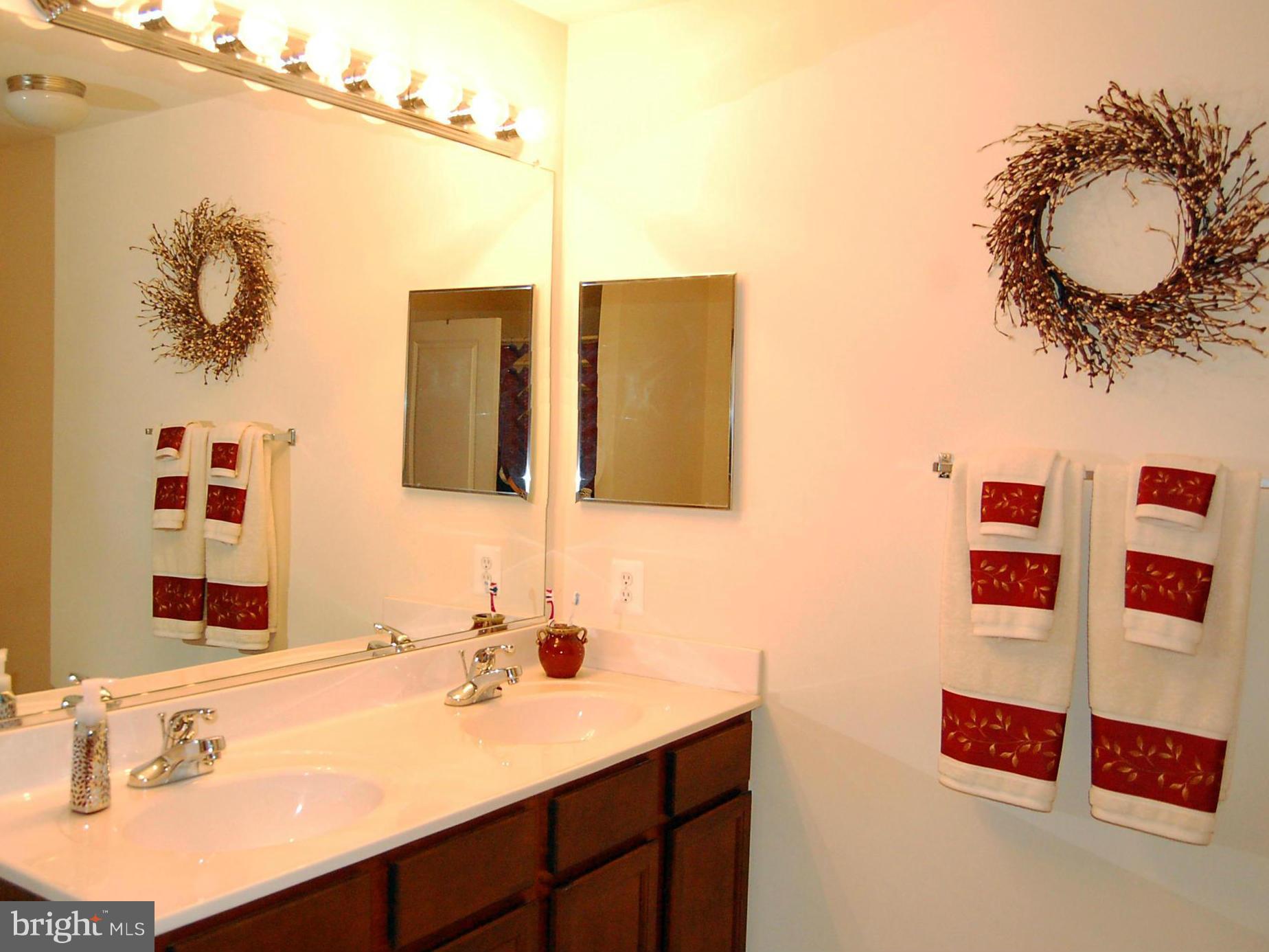 4021 Brummel Road Pasadena, MD 21122 - Photo 17 of 27 a bathroom with a sink and a mirror
