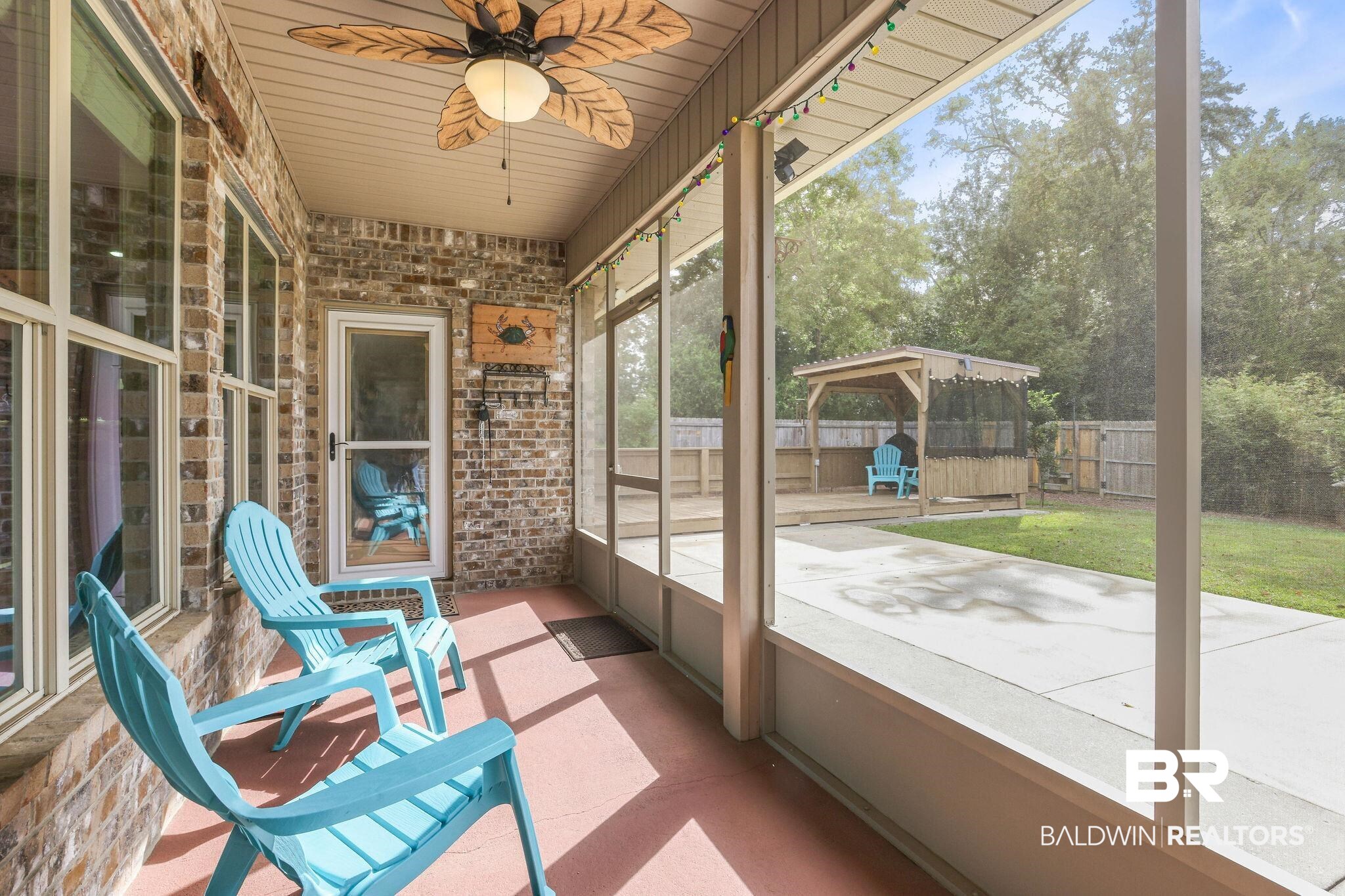 1086 Destin Avenue Foley, AL 36535 - Photo 19 of 30 Unfurnished sunroom with wood ceiling and ceiling fan
