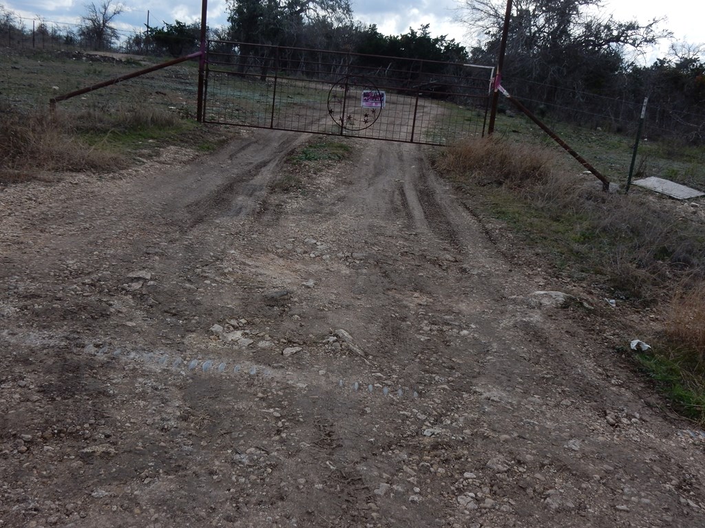 5101 Old Harper Road Harper, TX 78631 - Photo 2 of 17 a view of a yard with wooden fence