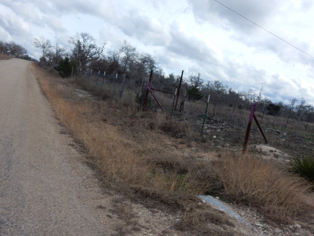 5101 Old Harper Road Harper, TX 78631 - Photo 5 of 17 a view of a dry yard with wooden fence