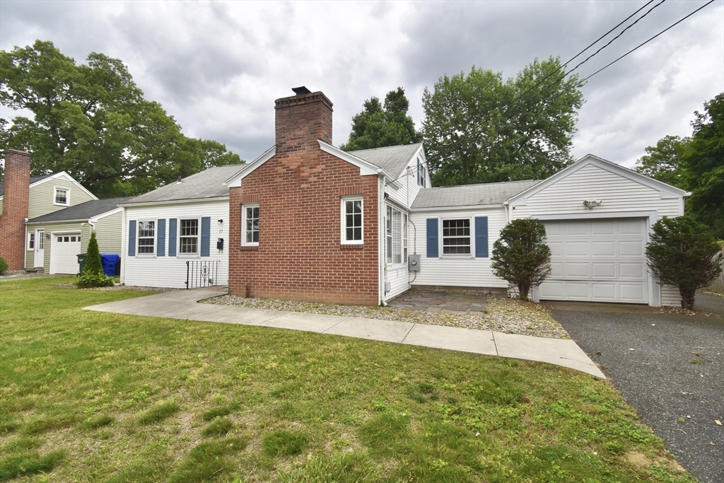 17 Old Brook Road Springfield, MA 01118 - Photo 1 of 23 a front view of a house with a garden and yard