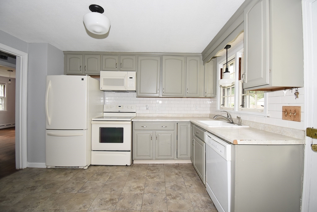 17 Old Brook Road Springfield, MA 01118 - Photo 13 of 23 a kitchen with a sink a stove a refrigerator and a sink