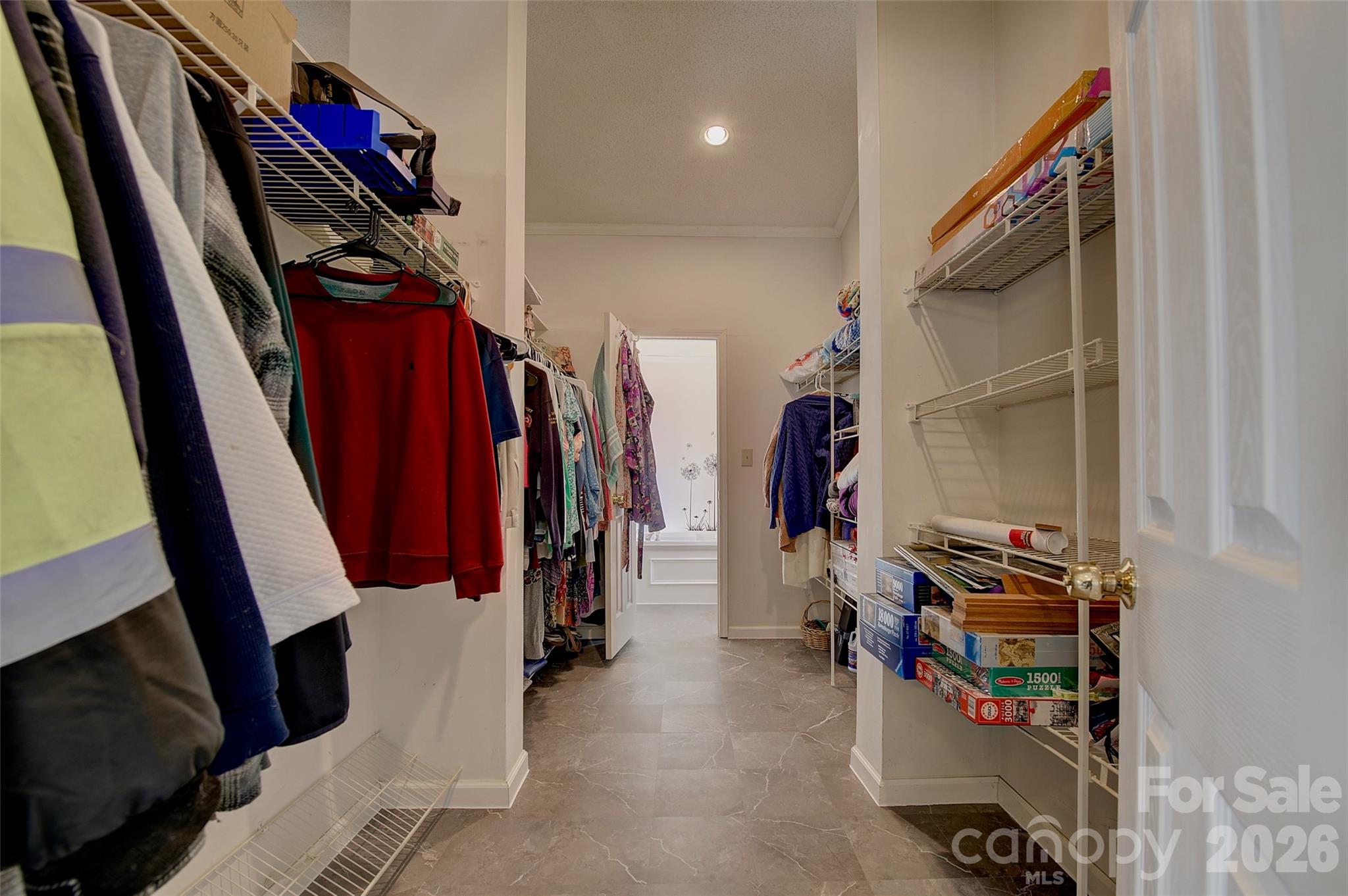 3 Altapass Trail Spruce Pine, NC 28777 - Photo 21 of 43 a view of walk in closet with clothes and shoes