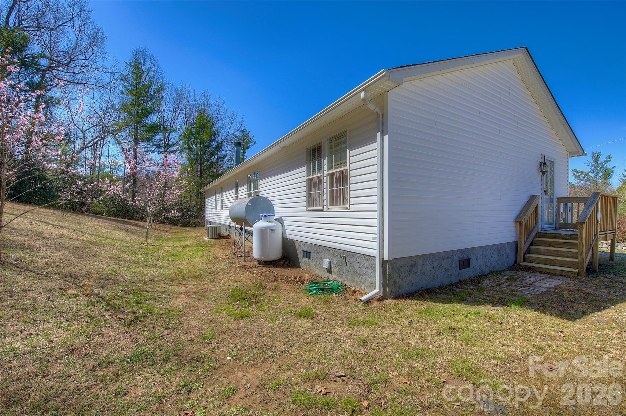 3 Altapass Trail Spruce Pine, NC 28777 - Photo 35 of 43 a view of a house with backyard and wooden fence