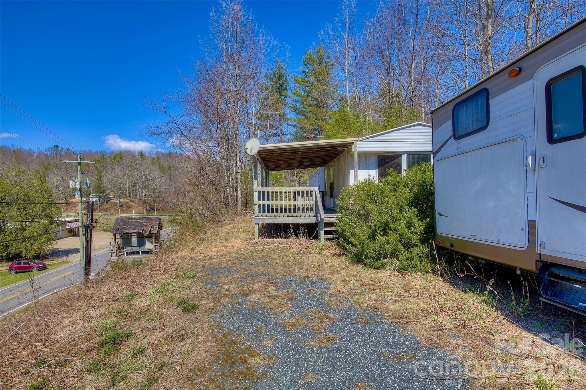 3 Altapass Trail Spruce Pine, NC 28777 - Photo 38 of 43 a view of a chairs and table in the back yard of the house