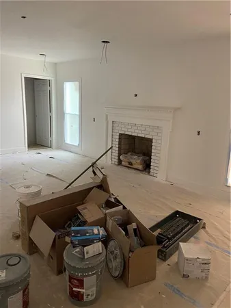 a room with furniture and a fireplace