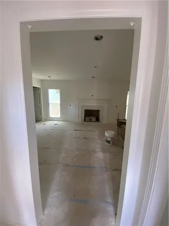 a view of a hallway to rooms