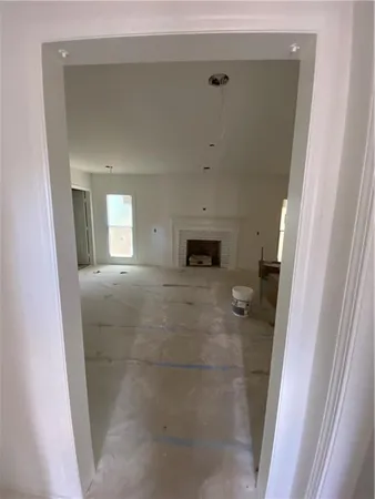 a view of a hallway to rooms