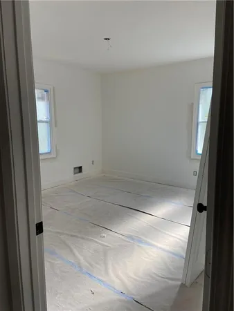 an empty room with windows