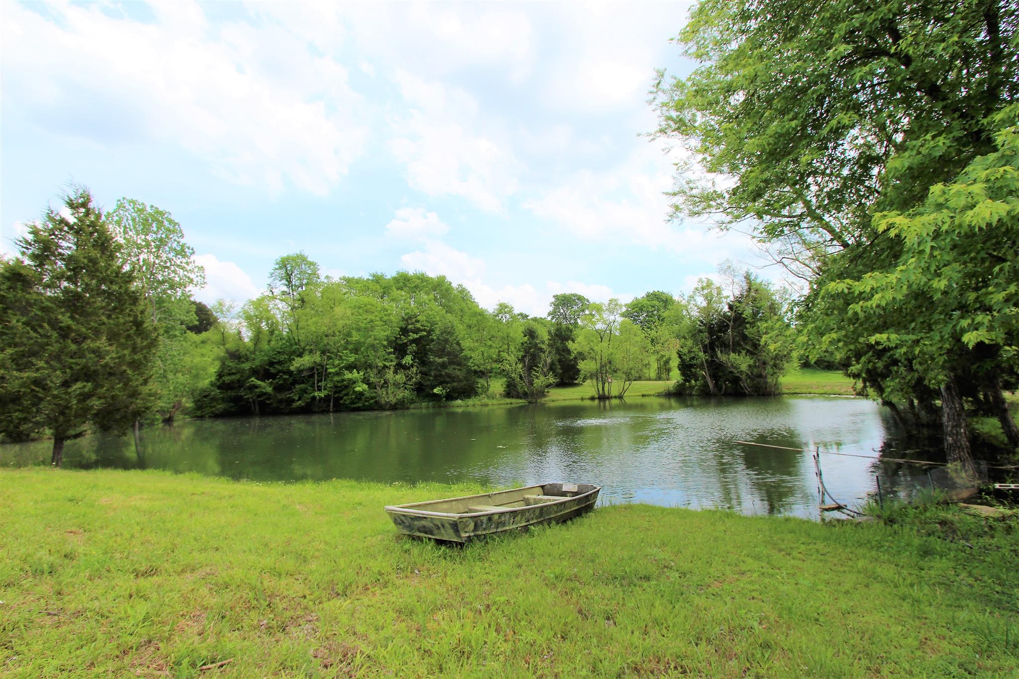 1073 Speck Road Lebanon, TN 37087 - Photo 1 of 20 a view of a lake with houses in the back