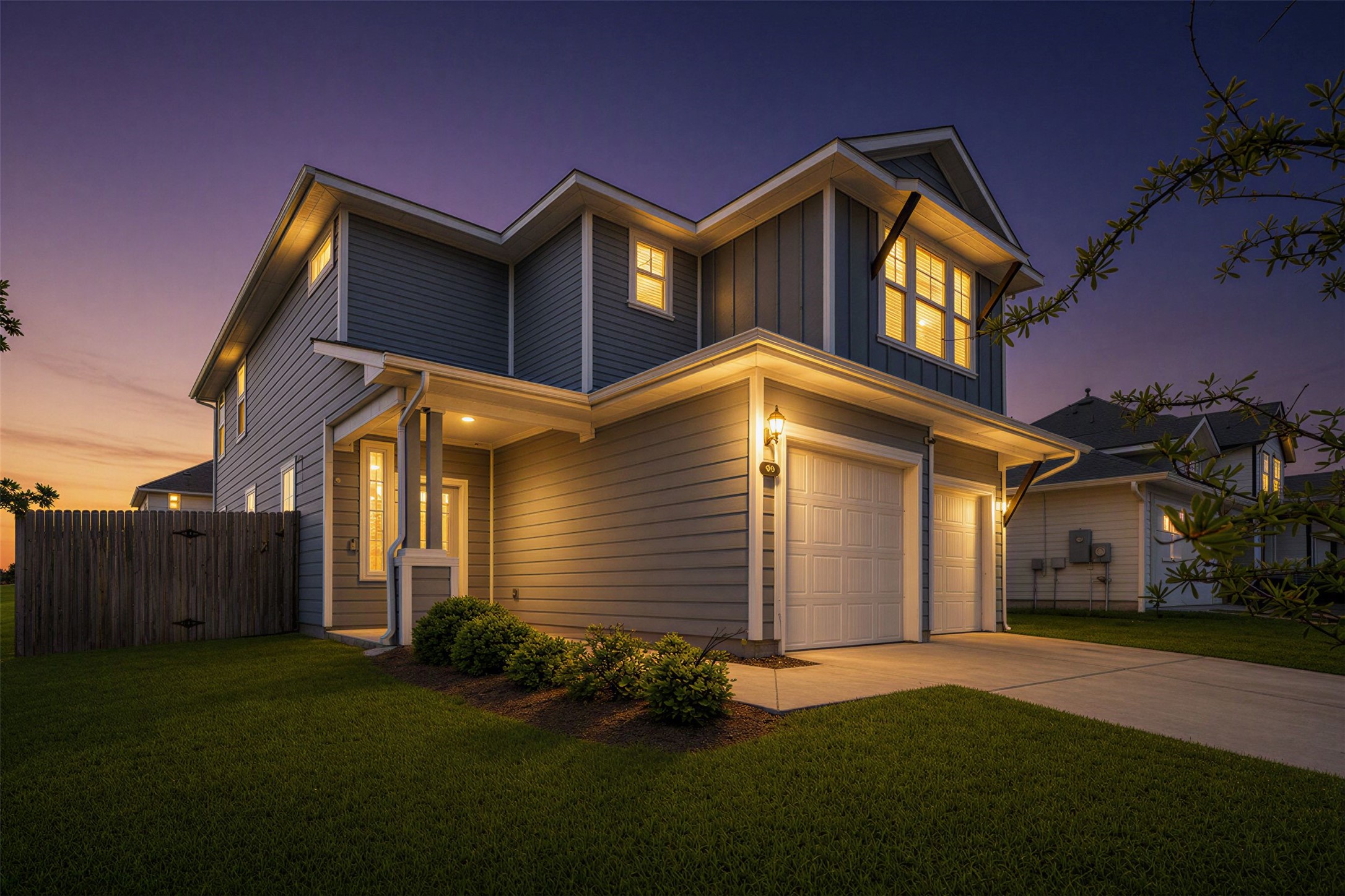 101 Crescent Street Georgetown, TX 78626 - Photo 31 of 39 View of front of home at dusk featuring a facade with a two-car garage welcomes you to this inviting residence.