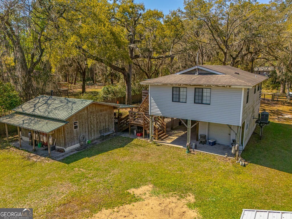 33 Warren Avenue Waverly, GA 31565 - Photo 57 of 63 a front view of house with yard and seating area