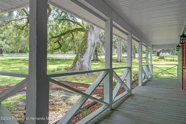 a view of swimming pool from a balcony