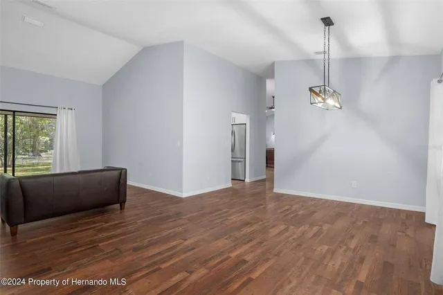 a kitchen with stainless steel appliances granite countertop wooden cabinets a stove top oven a sink and dishwasher