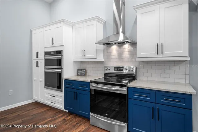 a kitchen with a sink and a refrigerator