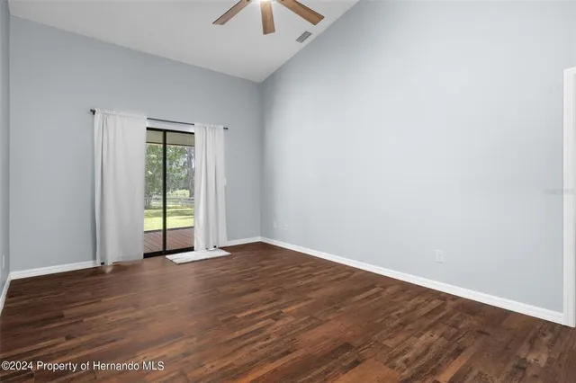a spacious bathroom with a double vanity sink a mirror and a shower