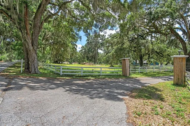 a view of outdoor space with deck and yard