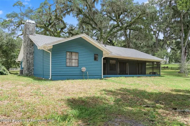 a house with yard in front of it