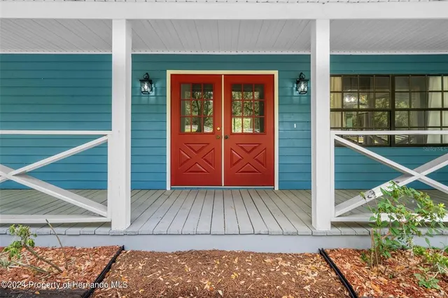 a view of a two chairs in the balcony