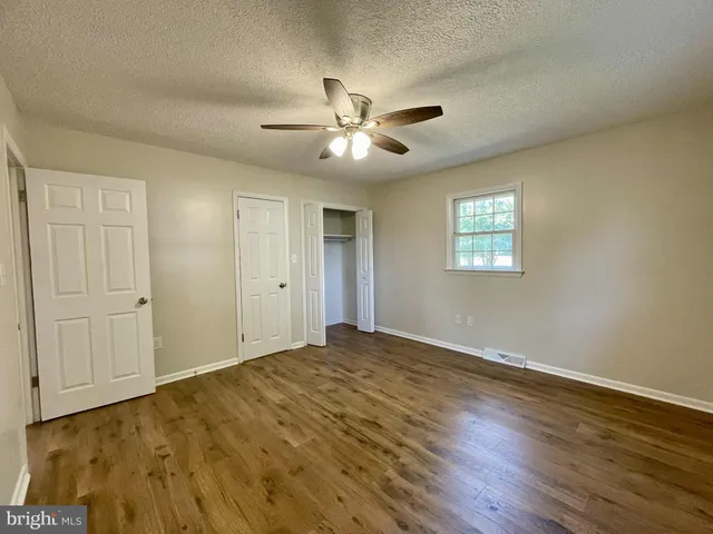 an entryway of a house with a fireplace and window
