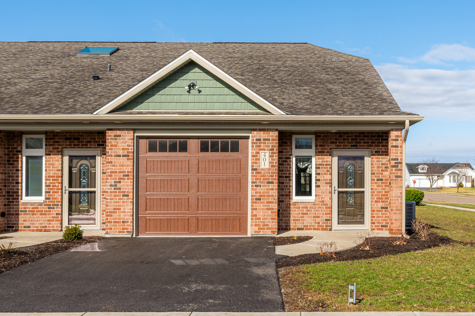 108 Boulder Court, Unit 108 Genoa, IL 60135 - Photo 1 of 25 front view of a house with a yard